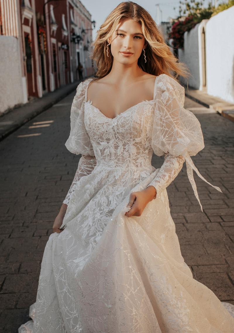 Photo of Model wearing a Adore by JA gown