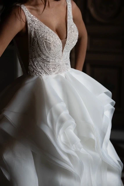 Photo of Model wearing a Adore by JA gown