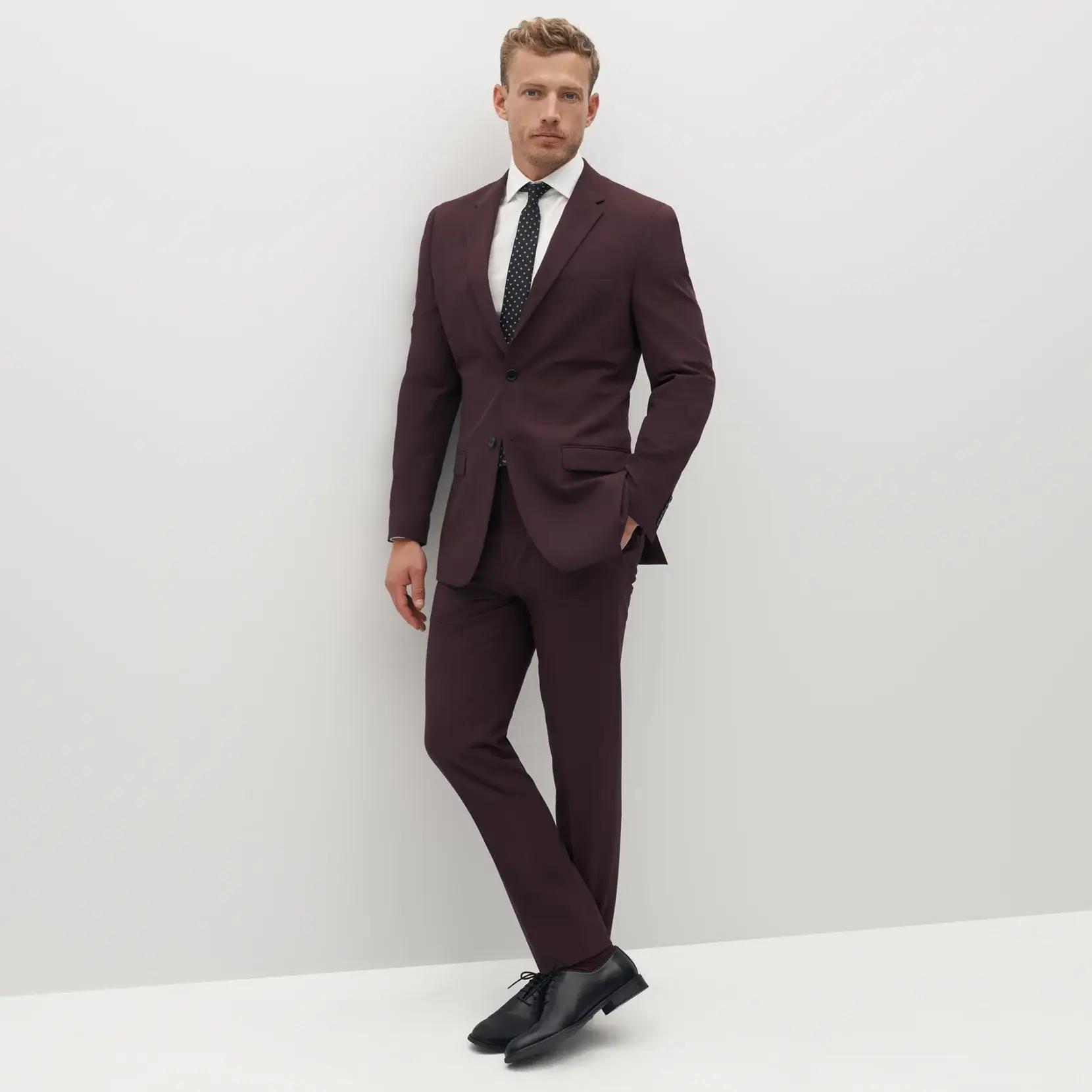 Man in burgundy suit