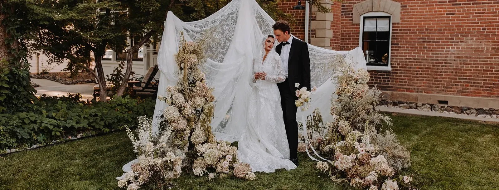 Сouple wearing a white gown and a black suit